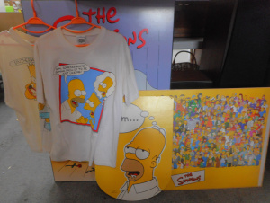 Lot 122 - Group Simpsons Block mounted Posters and 2 x T-Shirts