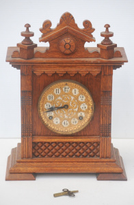 Lot 216 - c1900 Ansonia oak mantle Clock with ornate gilt face