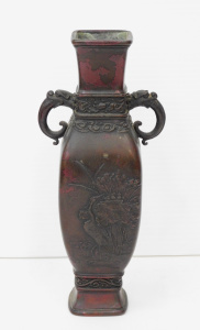 Lot 368 - Vintage Oriental Bronze Twin handled vase - Dragon handles Raised stor