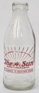 Lot 386 - Vintage 1 Pint Milk Bottle w Transfer printed The Sun News Pictorial