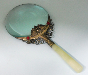 Lot 50 - Eastern Magnifying glass - white metal surround with jadeite handle