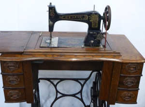Lot 116 - Vintage New Century Treadle Sewing Machine - Made in USA, w carved dec