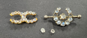 Lot 320 - 2 x c1900 Moonstone Brooches - sil & gold both af - 2 stones loose