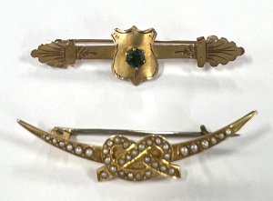 Lot 324 - 2 x 1900 9ct gold bar Brooches - central shield with emerald & lo