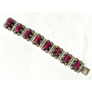 Lot 278 - 1960s wide Mexican silver bracelet set with oblong pink Tourmaline cat