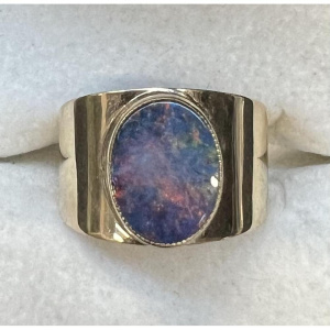 Lot 287 - 9ct gold opal Ring - raised setting on wide band - TW 2 9grms