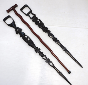 2 x vintage walking slticks inc Two carved ebony & stained wooden