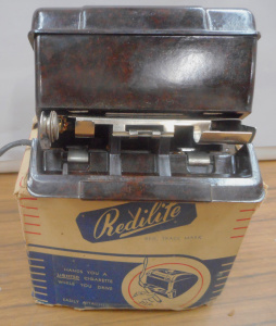 Lot 243 - Vintage Boxed Bakelite Redilite Cigarette Dispenser for a Car (Hands