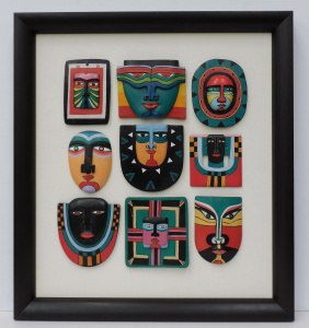 Lot 167 - Set of 9 Framed colourful hand decorated Masks 58cm x 52cm