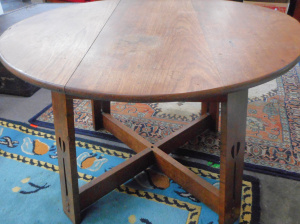 Lot 4 - Circular Oak Arts & Craft Table with decorative pierced legs, 62cmH