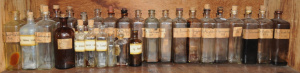 Lot 164 - Group Lot Vintage Glass Apothecary Bottles - most with original paper