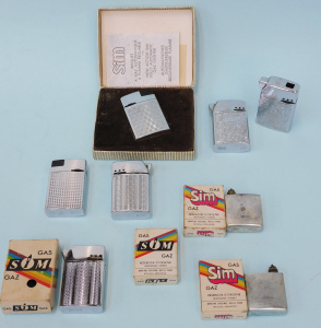 Lot 252 - Group lot - Vintage Sim Gas Cigarette Lighters & accessories - 2 x