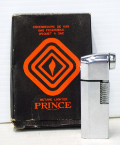 Lot 280 - Vintage Prince 'Pi Pette' Silver Tone Cigarette Lighter - in Original