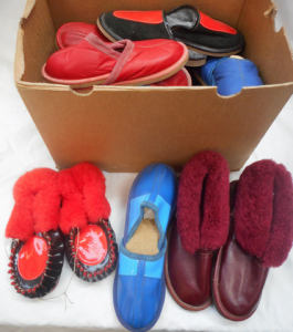 Box of colourful as-new pairs of shoes - Uggs boots, slip-ons, moccasins