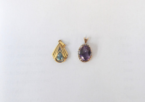 2 x 9ct gold pendants - oval Amethyst surrounded by small diamonds & pear sh