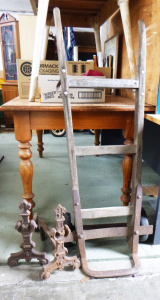 2 x Vintage items inc, a pair of Cast Iron Firedogs and wooden Goods Trolley