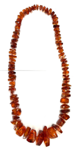 1930s long polished graduated Amber bead necklace - approx 70 cms L