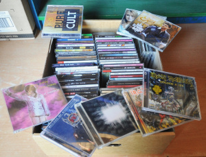 Lot 33 - Box lot of CDs w Some Signed incl Iron Maiden, Tool, ABBA, Cult, Green