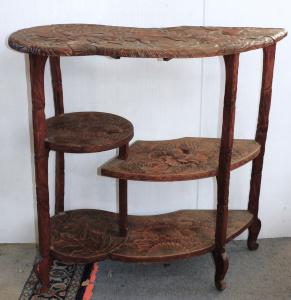 Lot 209 - 1930s Carved Shelving unit - unusual shape with three tiers - raised f