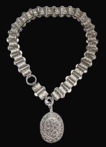 Lot 337 - c1900 Silver flat wide chain collarnecklace and oval locket with chast