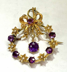 Lot 348 - c1900 15ct gold pendantbrooch - floral circle with drop & bow to t